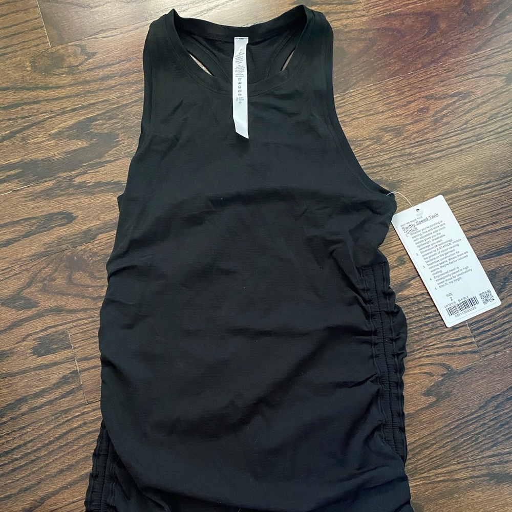 New with tags Lululemon side cinch black workout top